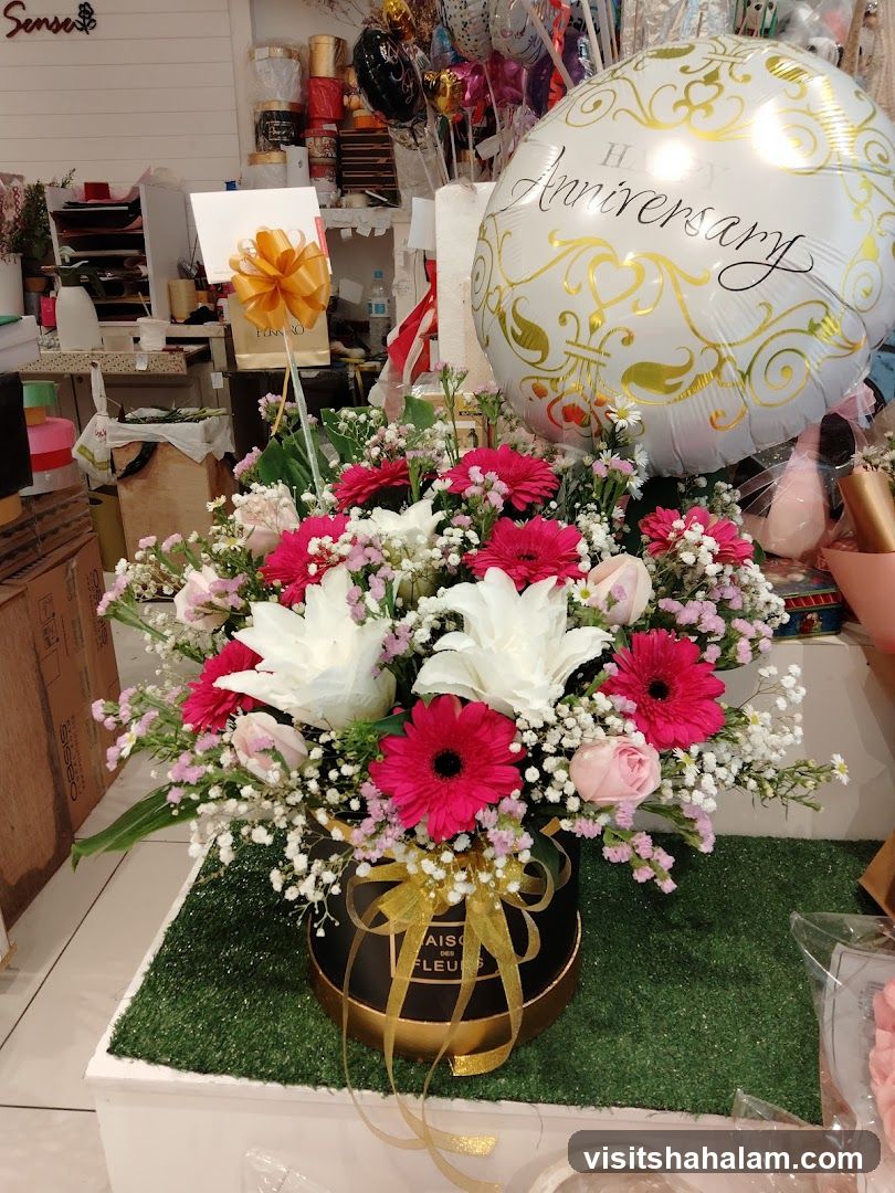 Flower arrangement with anniversary balloon