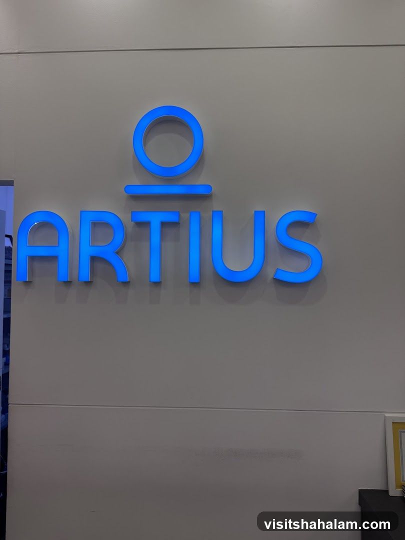 Blue illuminated logo on a wall