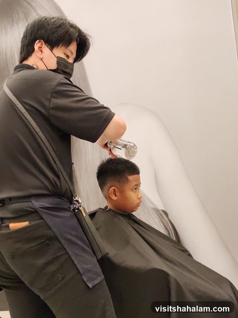 Barber giving a haircut to a child