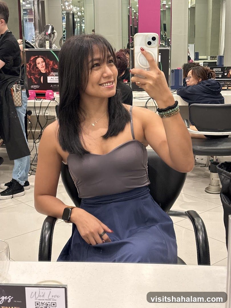 Woman taking a selfie in a salon