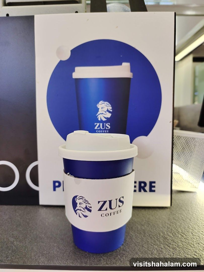 ZUS Coffee Cup and Advertisement