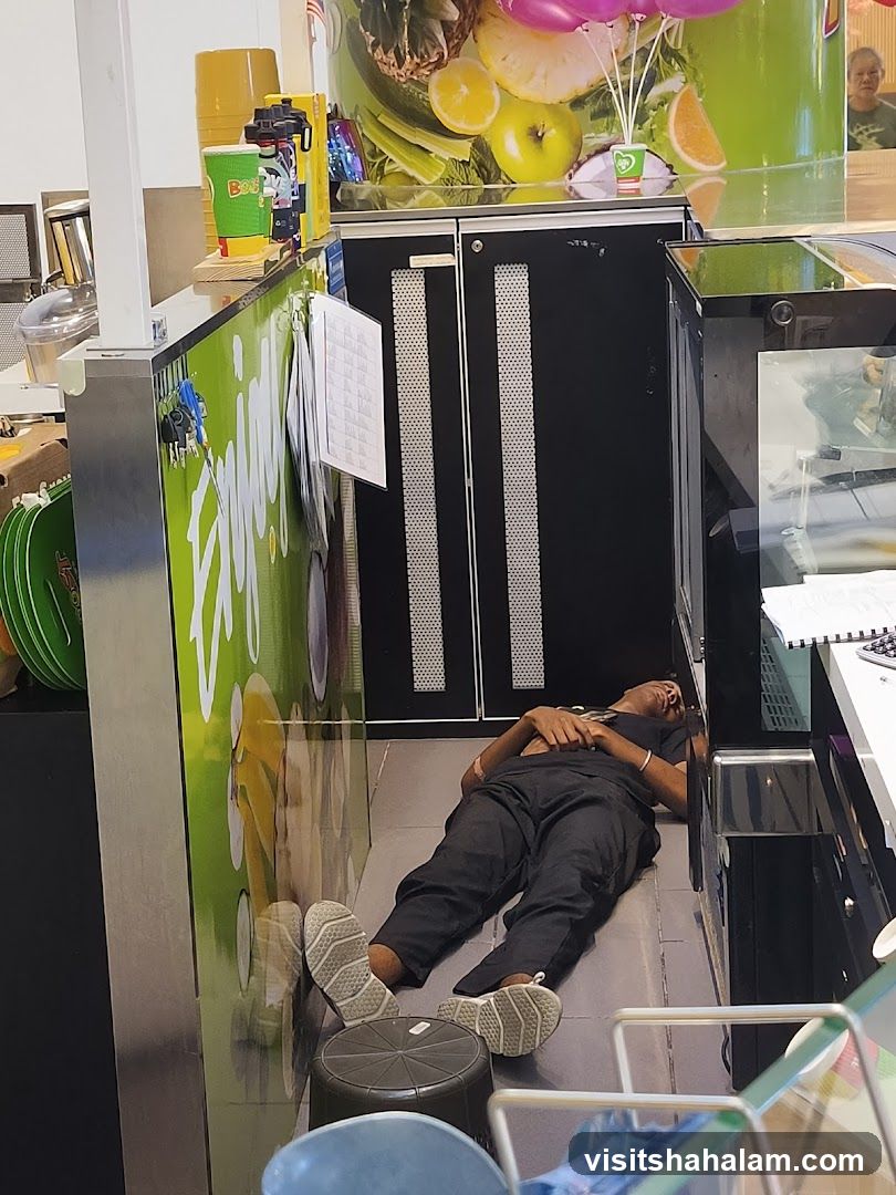 Man sleeping at juice bar counter