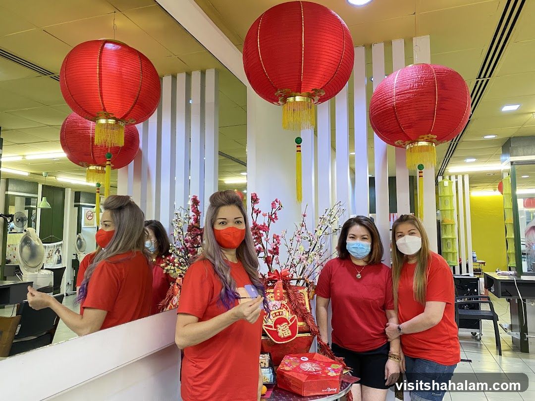Women in Red Shirts with Chinese New Year Decorations