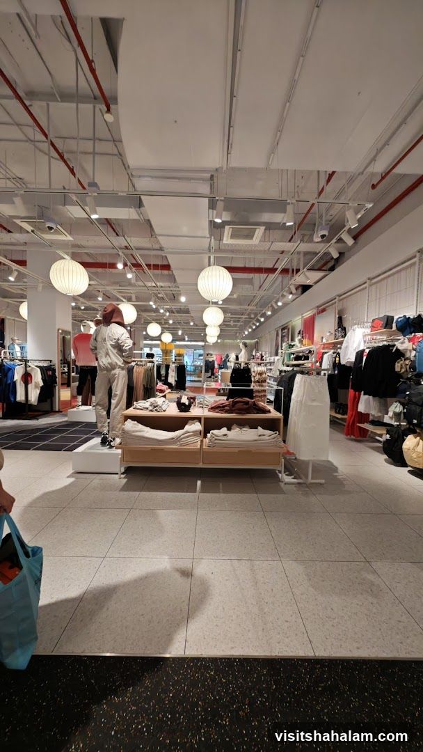 Clothing store interior with mannequins and clothing racks
