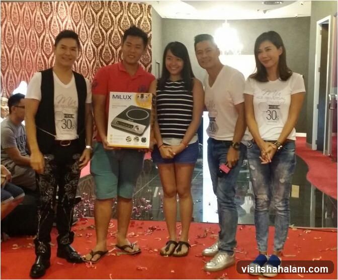 Group posing with a product