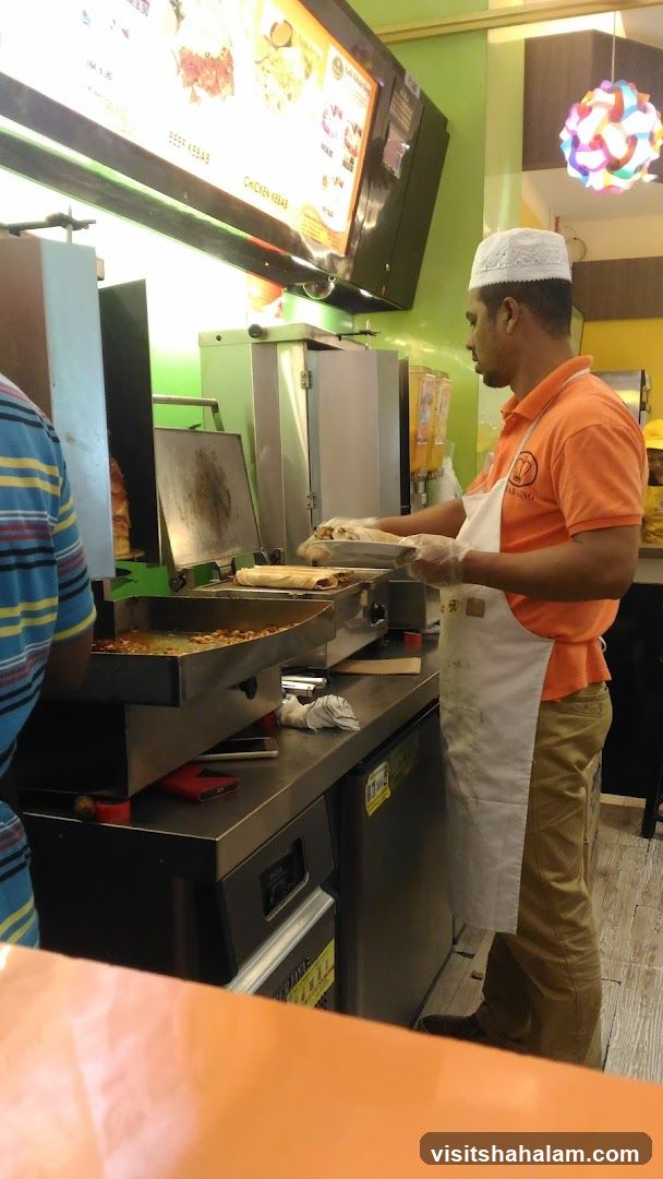 Man preparing food at a counter