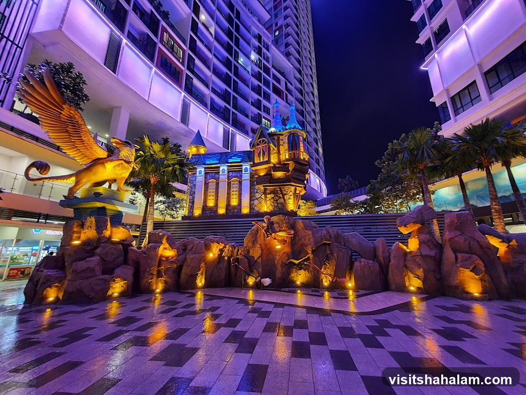 Fantasy-themed outdoor plaza at night