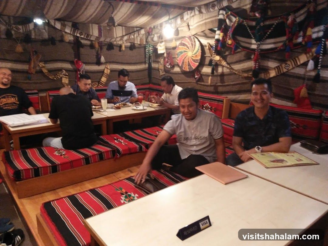 People dining in a tent-like restaurant