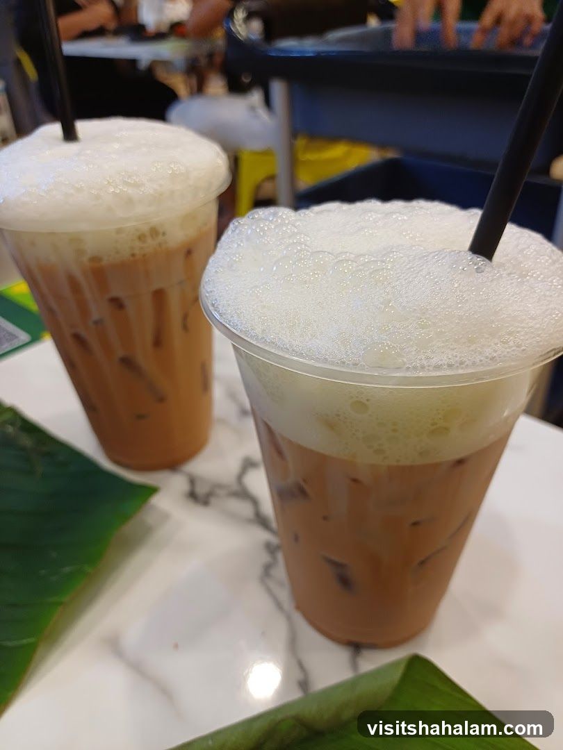 Two iced drinks with foam