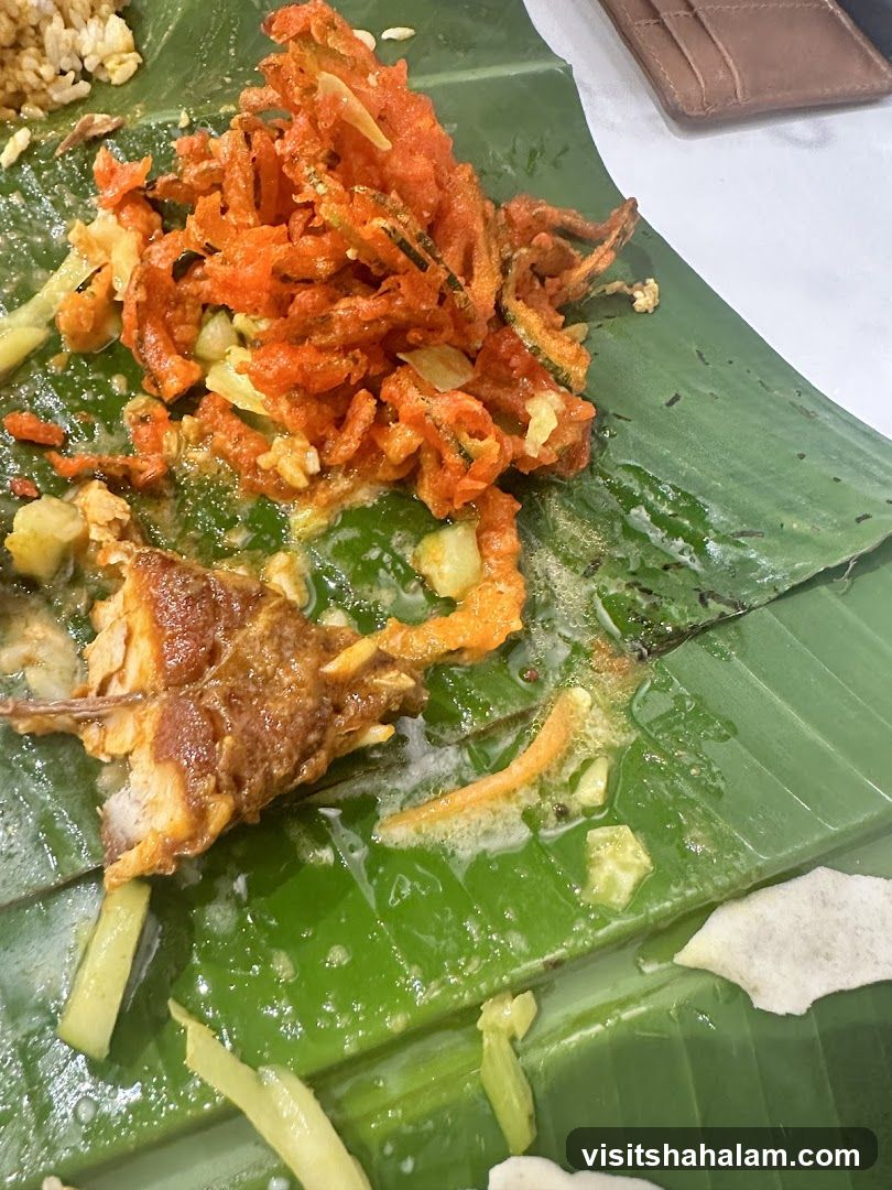 Fried Vegetables and Fish on Banana Leaf