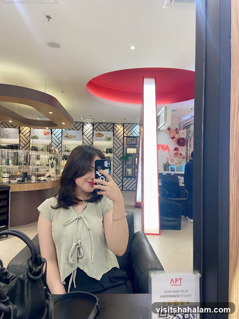 Woman taking a selfie in a salon