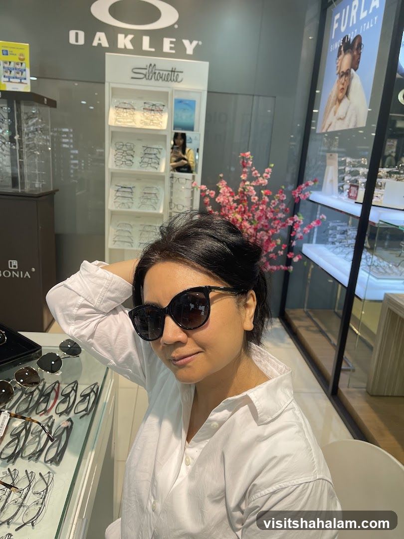 Woman trying on sunglasses