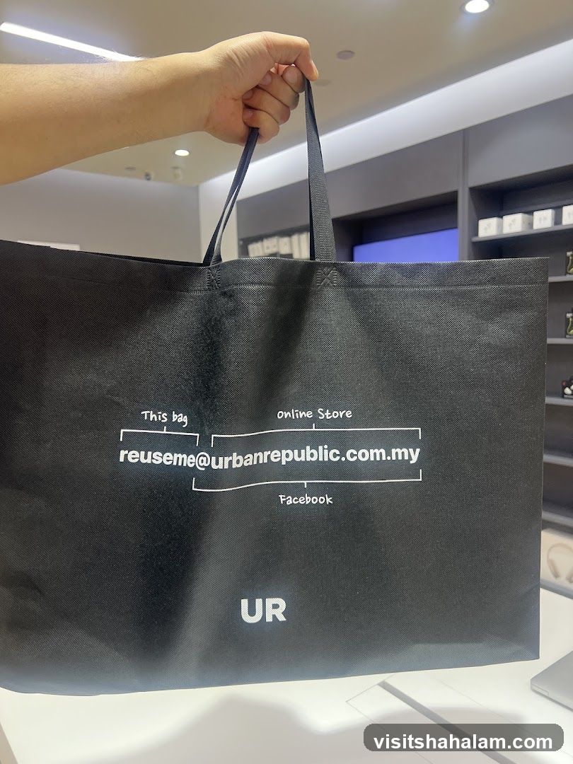 Black reusable bag with brand information