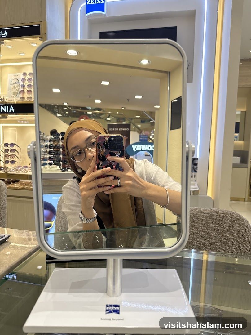 Woman taking a selfie in a mirror at an optical store