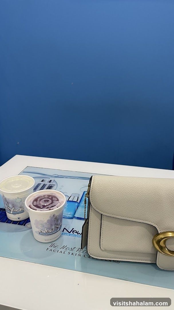 Two drinks and a handbag on a counter