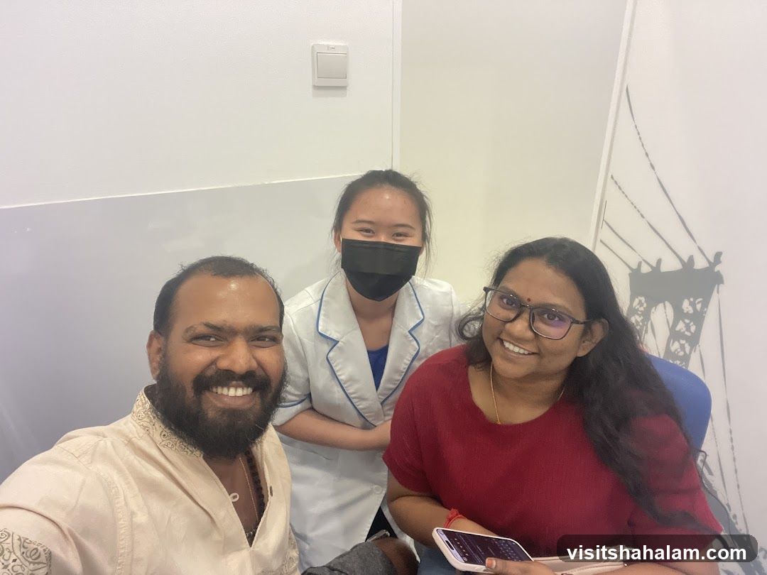 Three people smiling for a selfie