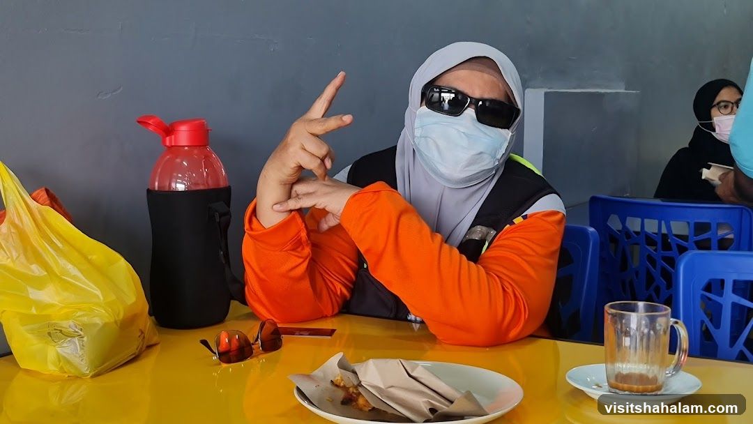 Person posing at a table