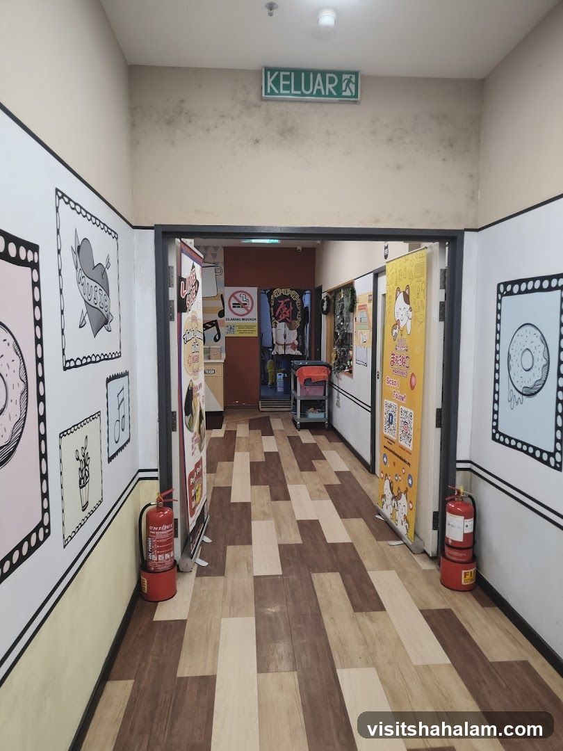 Hallway with cartoon art and fire extinguishers