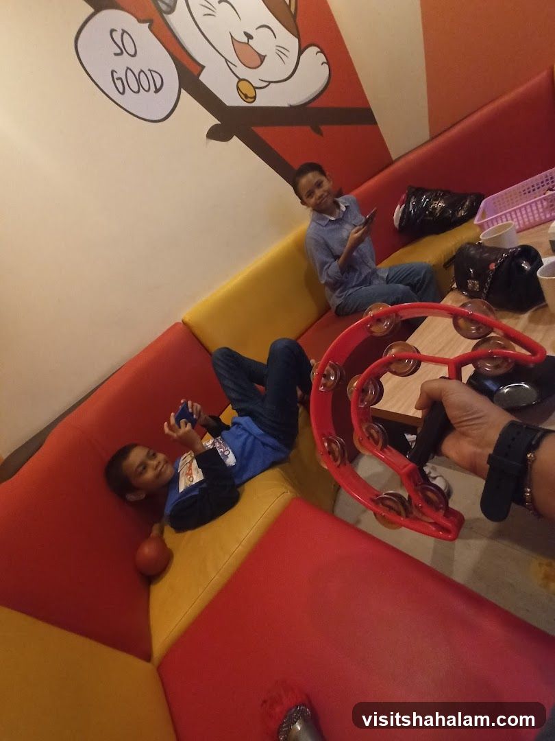 Children playing in a colorful booth