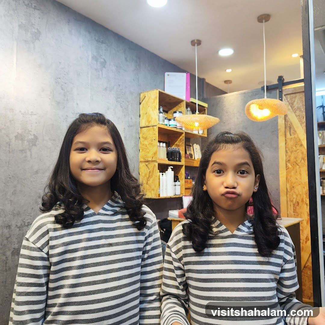 Two girls in striped hoodies