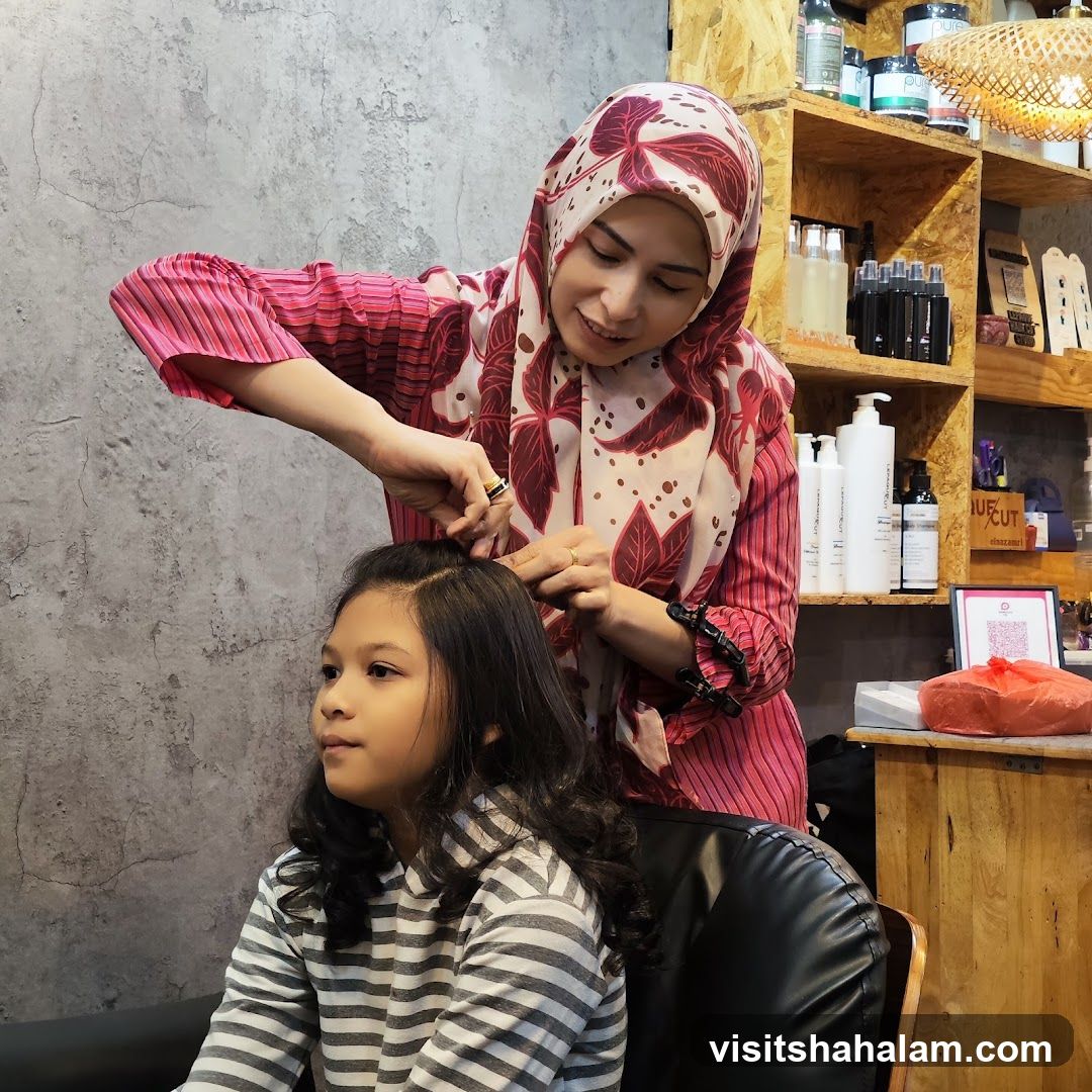 Hairdresser styling a child's hair