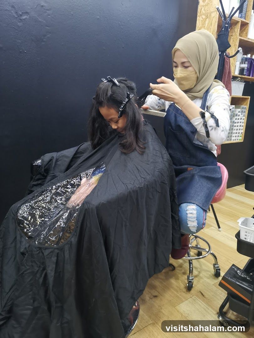 Hairdresser cutting a child's hair