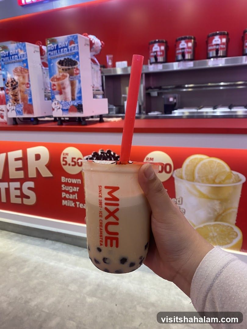 Person holding a bubble tea drink