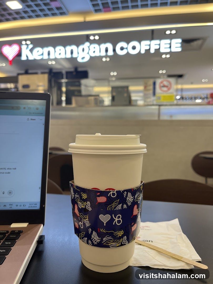 Kenangan Coffee Cup and Laptop