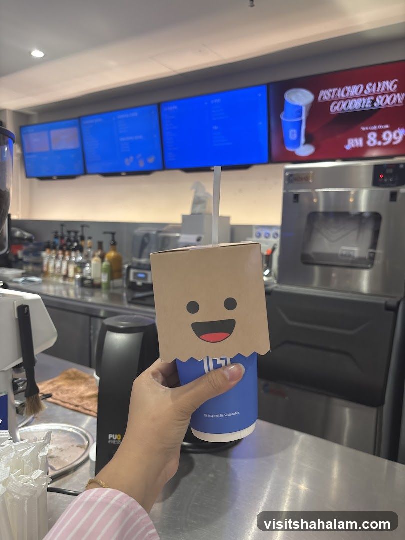 Coffee cup with a cartoon face sleeve