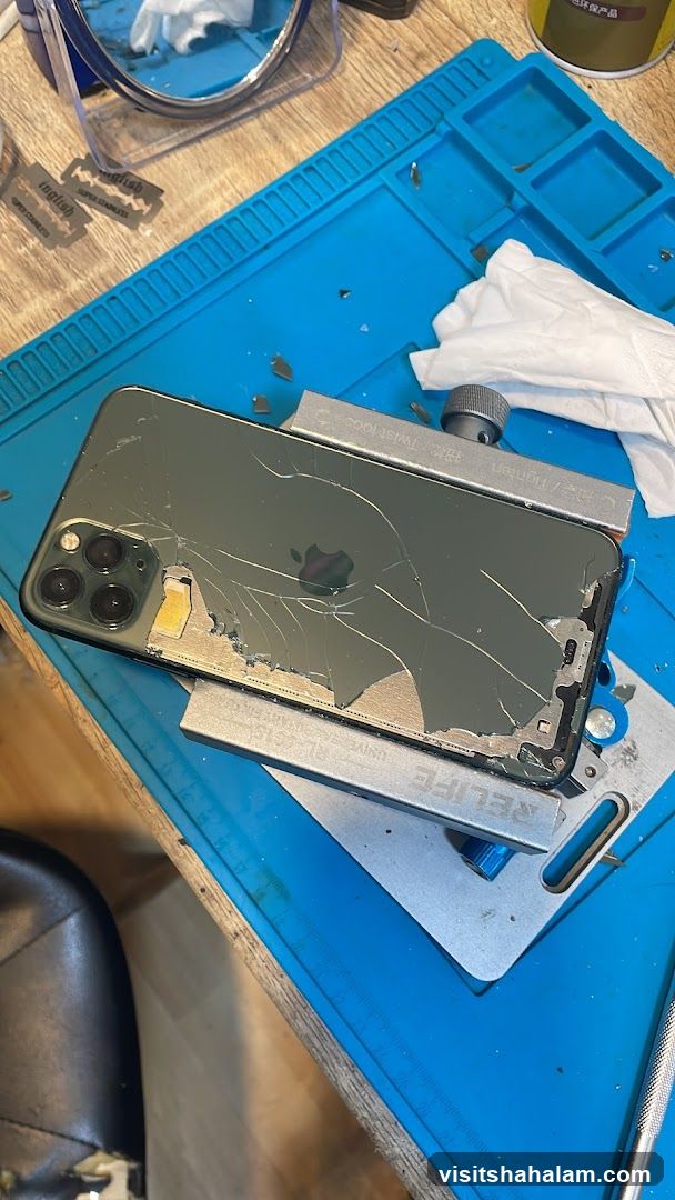 Damaged iPhone on Repair Mat