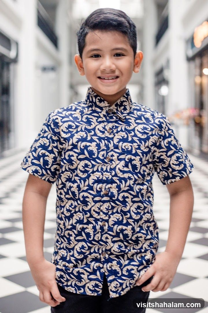Young boy in patterned shirt