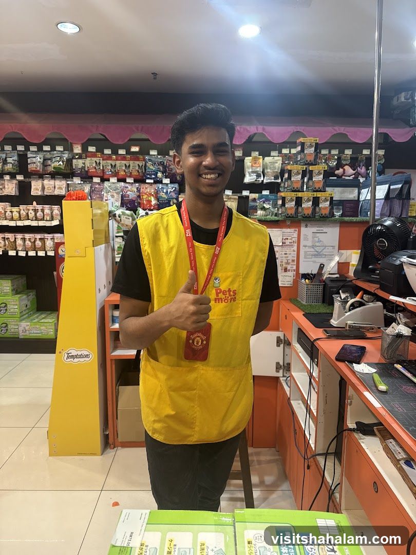 Employee giving a thumbs up in a pet store
