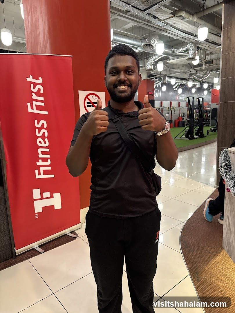 Man giving thumbs up in gym