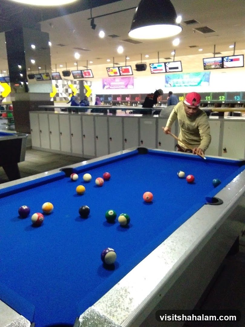 People playing pool in a bowling alley