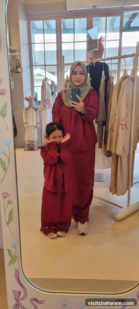 Woman and child posing in a boutique