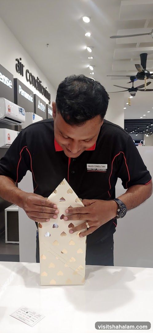 Sales consultant wrapping a gift