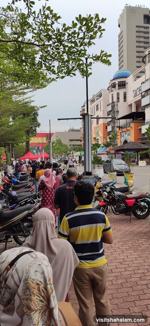 People queuing outside shops