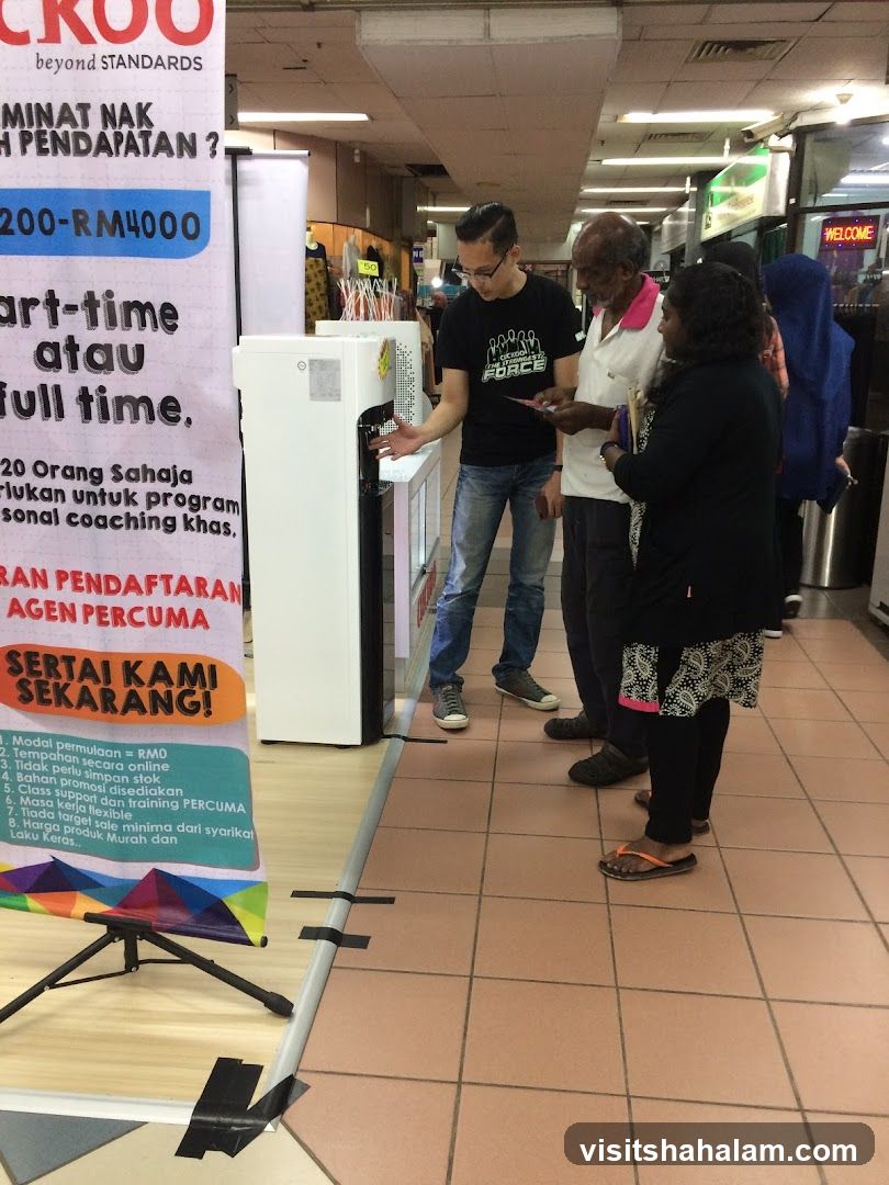 People interacting at a booth