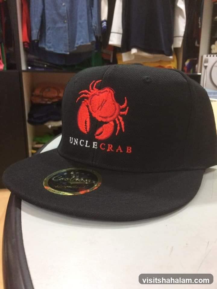 Black baseball cap with red crab logo