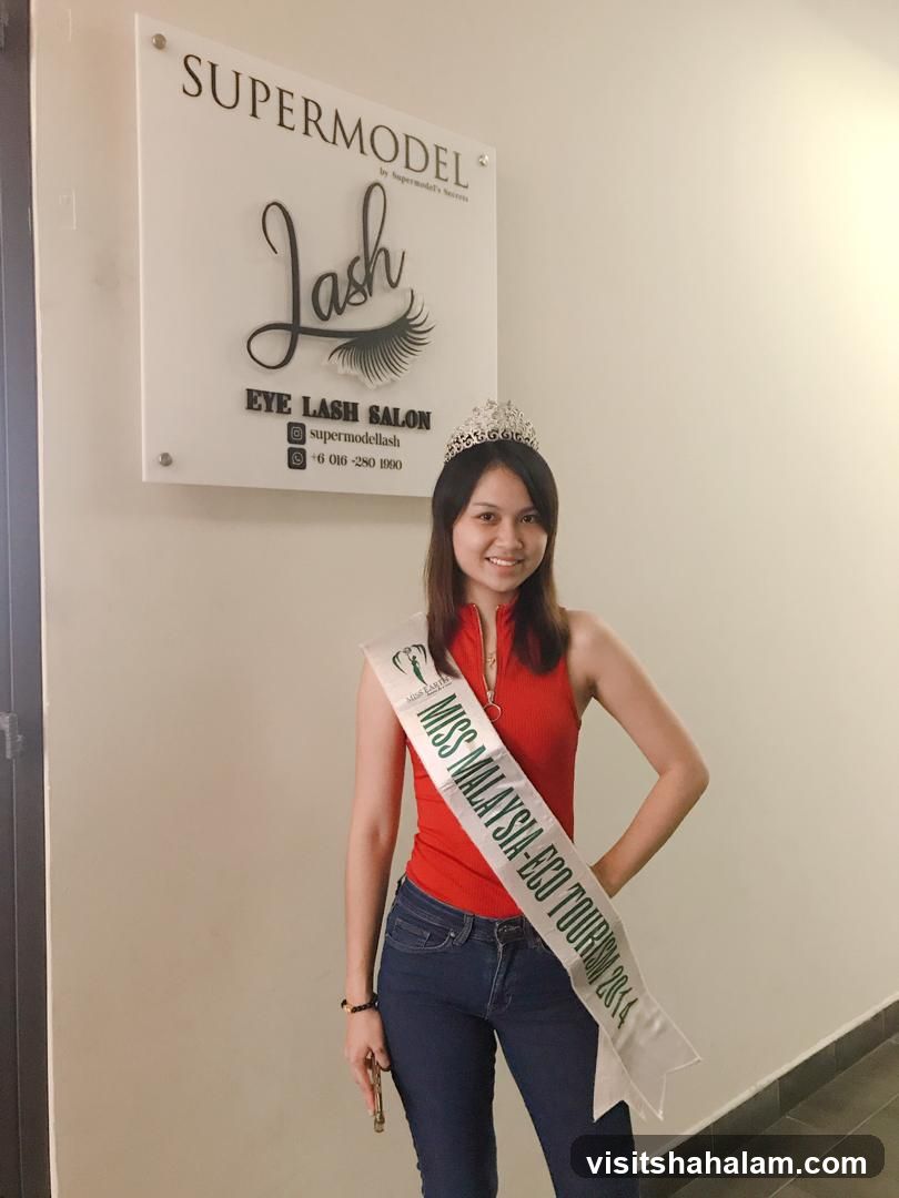 Woman with Miss Malaysia sash and crown