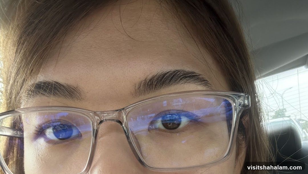 Close-up of a person's eyes and glasses
