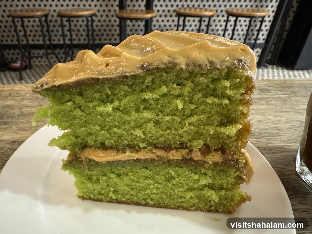 Slice of Green Cake with Caramel Frosting