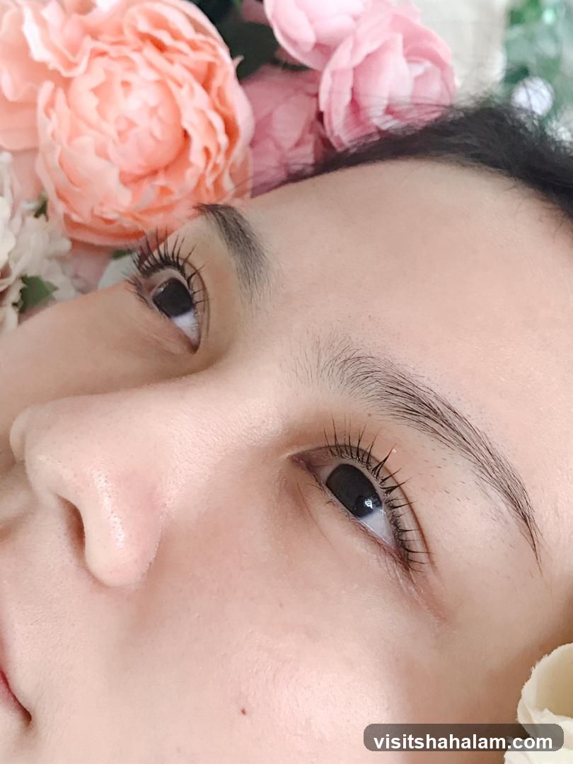 Close-up of a woman's eye with flowers