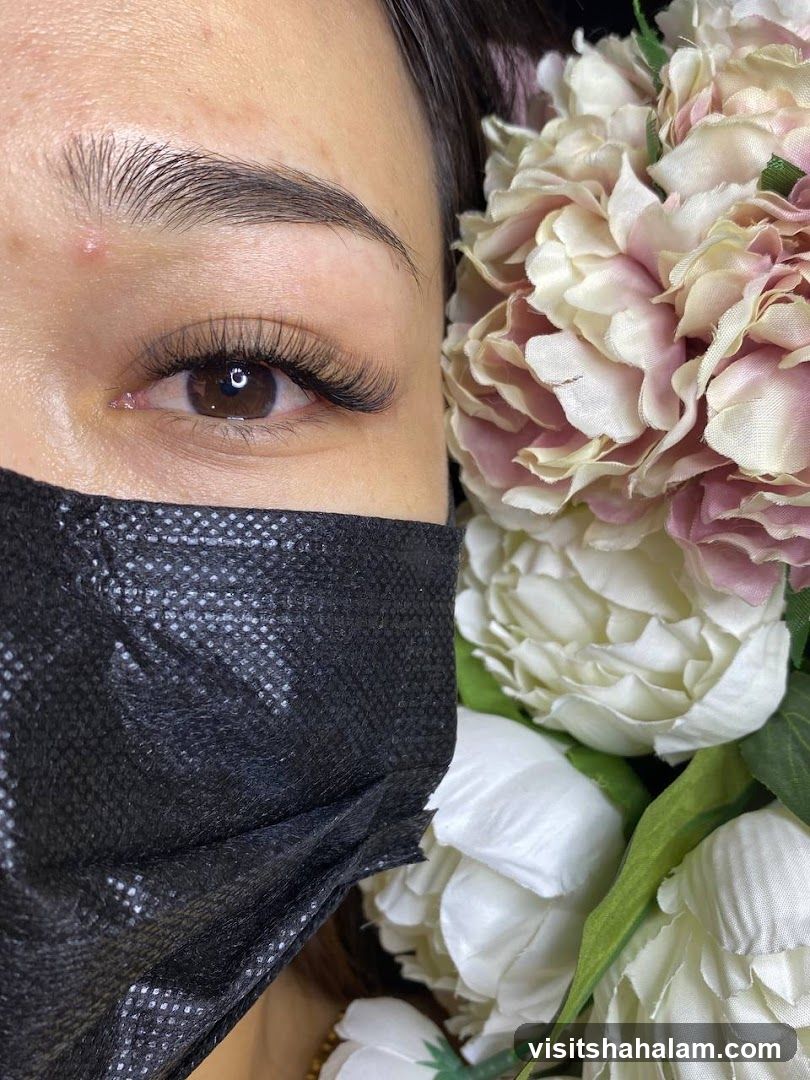 Close-up of a woman's eye with eyelash extensions
