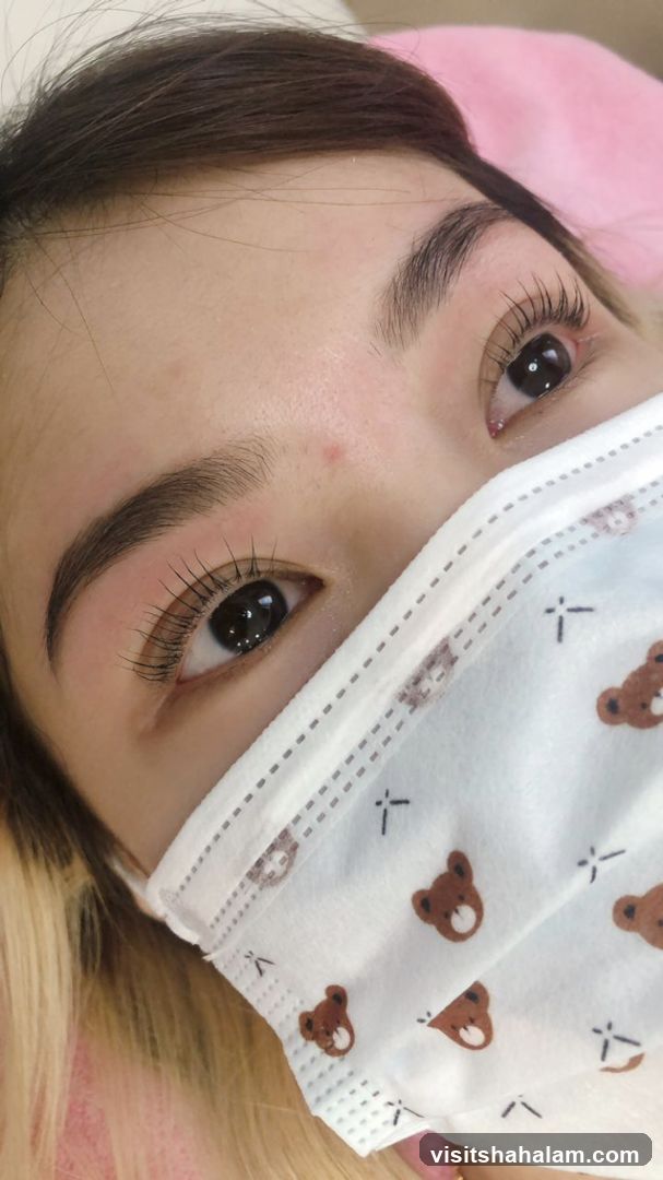 Close-up of a woman's eyes and face with a mask