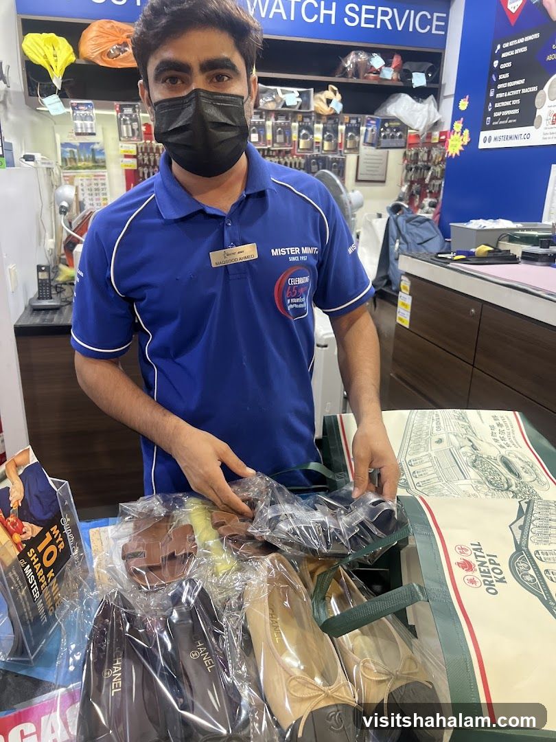 Mister Minit Employee with Merchandise