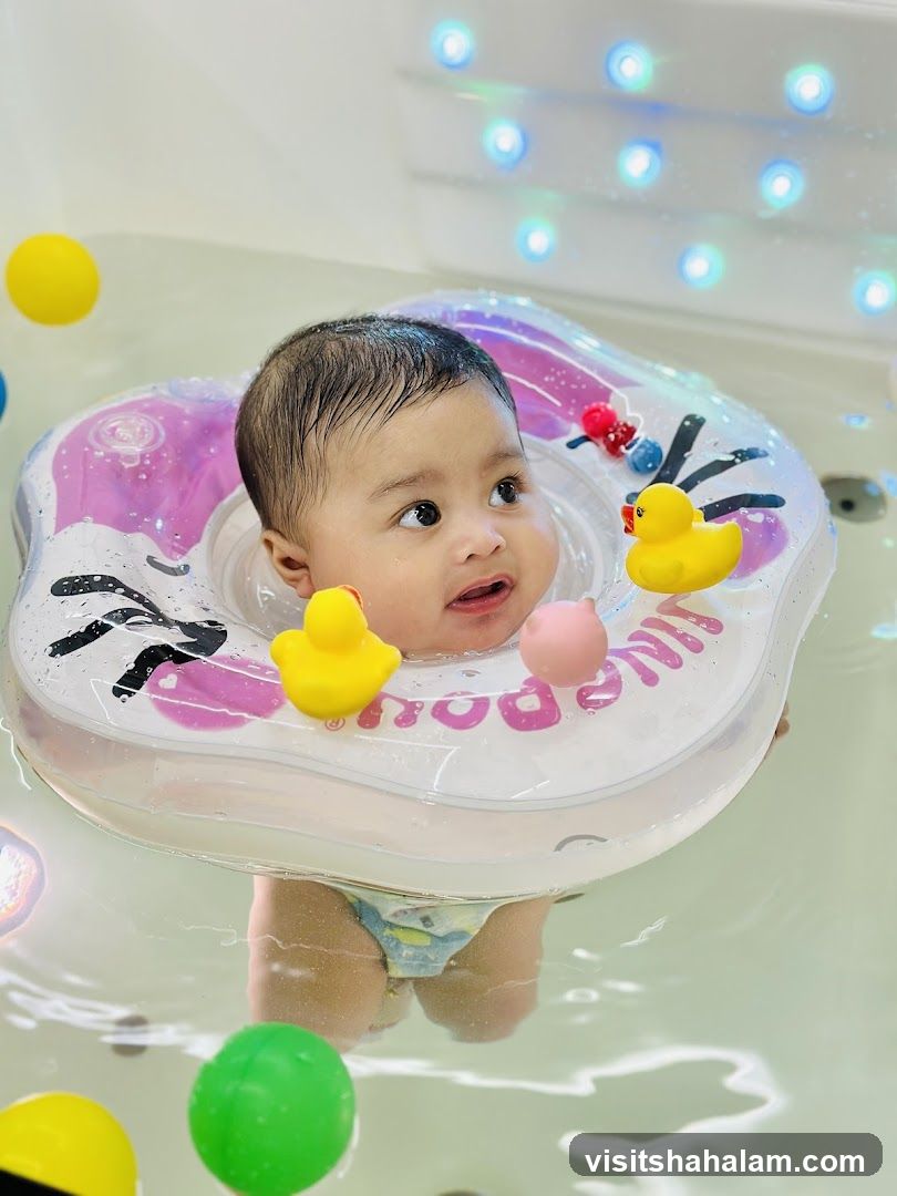 Baby in a bathtub with a swim ring
