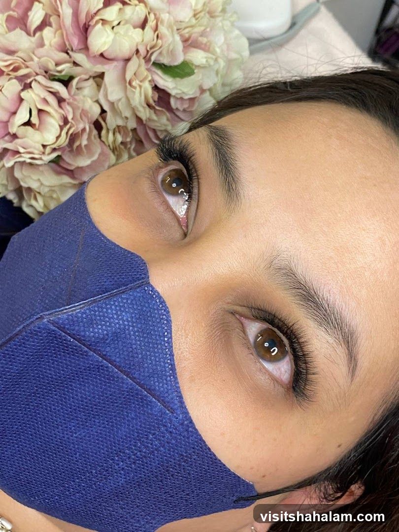 Close-up of a woman's eye with eyelash extensions