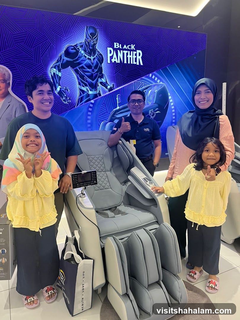 Family Poses with Massage Chair and Black Panther Display