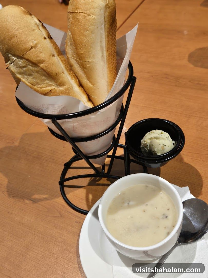 Bread basket with soup and butter
